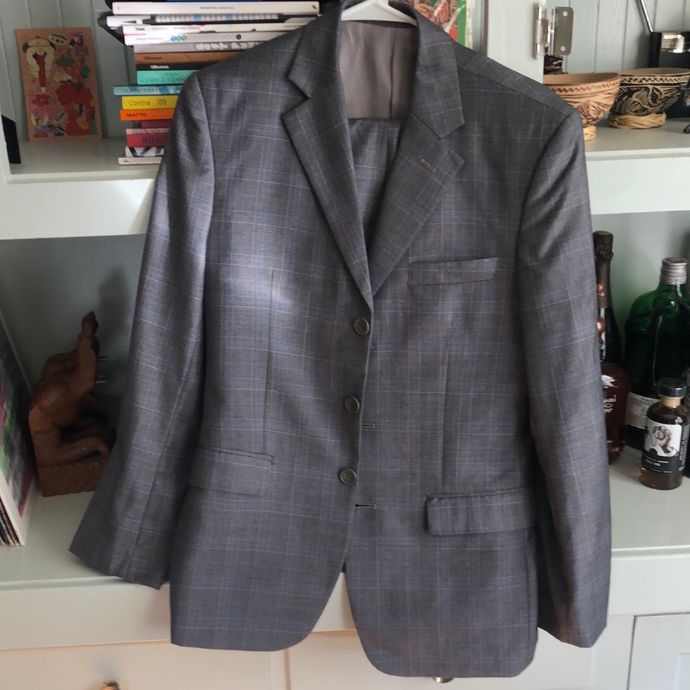 Light grey, blue pink faint checkered suit.